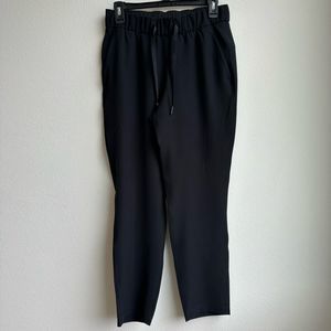 Lululemon On the Fly 7/8 Pant Black Drawstring Joggers Size 6 Lightweight stretc